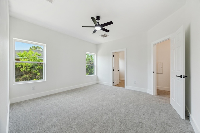3700 Avenue S, Santa Fe, TX 77510 - unfurnished bedroom with carpet, baseboards, ceiling fan, and connected bathroom