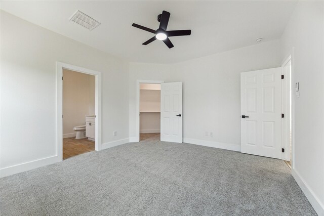 3700 Avenue S, Santa Fe, TX 77510 - unfurnished bedroom with carpet, a spacious closet, ensuite bathroom, and baseboards