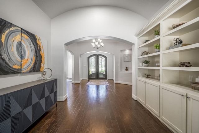 12911 Mossy Shr, Tomball, TX 77375 - entrance foyer with arched walkways, french doors, dark wood-style flooring, a chandelier, and baseboards