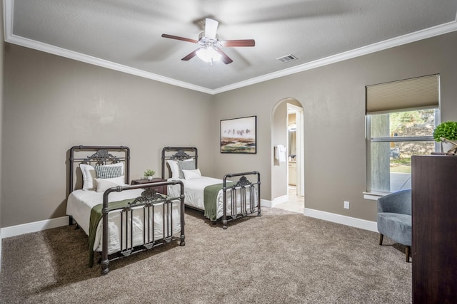 12911 Mossy Shr, Tomball, TX 77375 - carpeted bedroom featuring arched walkways, ornamental molding, baseboards, ensuite bath, and a ceiling fan