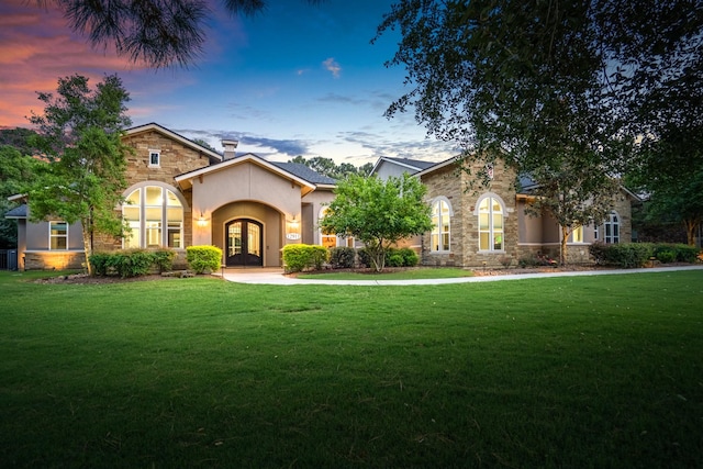 12911 Mossy Shr, Tomball, TX 77375 - view of front of house with french doors, stone siding, and a lawn