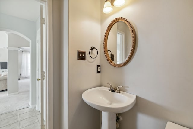 19710 Ringwald Ct, Spring, TX 77379 - bathroom with tile patterned floors, ornate columns, and a sink