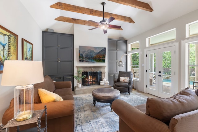 63 N Wooded Brook Cir, The Woodlands, TX 77382 - living room featuring healthy amount of natural light, a fireplace, and ceiling fan