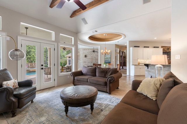 63 N Wooded Brook Cir, The Woodlands, TX 77382 - living room featuring french doors, a ceiling fan, and a chandelier