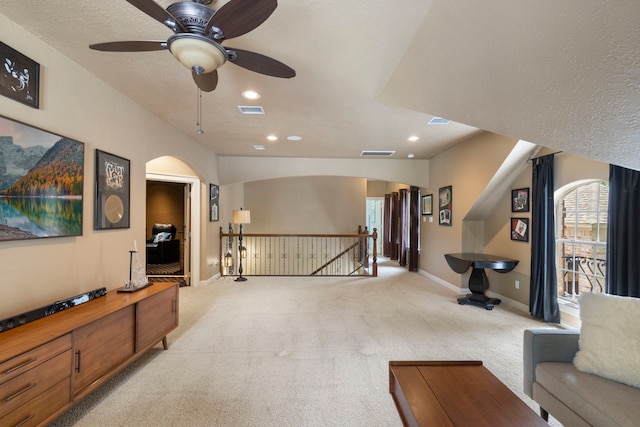 63 N Wooded Brook Cir, The Woodlands, TX 77382 - living area featuring an upstairs landing, light colored carpet, recessed lighting, a ceiling fan, and baseboards