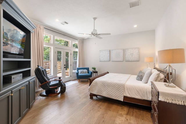 63 N Wooded Brook Cir, The Woodlands, TX 77382 - bedroom with access to exterior, french doors, light wood-style flooring, a ceiling fan, and recessed lighting