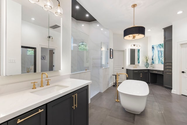 63 N Wooded Brook Cir, The Woodlands, TX 77382 - full bathroom with a shower stall, two vanities, a freestanding tub, recessed lighting, and tile patterned floors