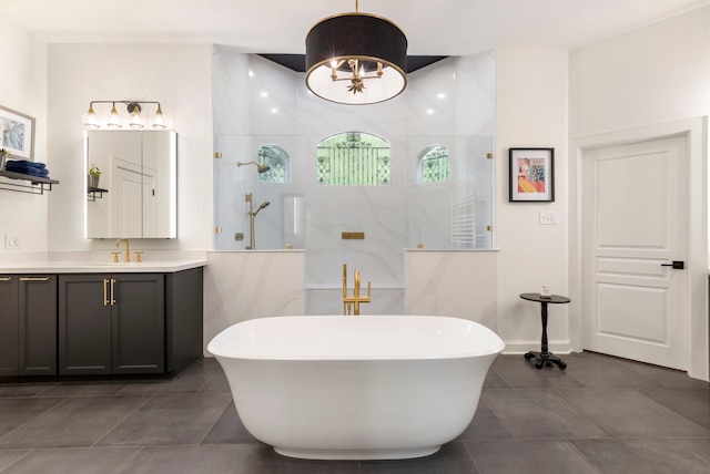 63 N Wooded Brook Cir, The Woodlands, TX 77382 - bathroom with vanity, walk in shower, a soaking tub, and tile patterned floors
