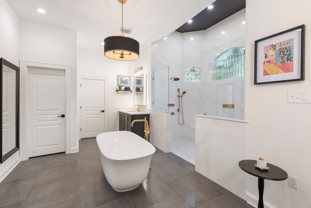63 N Wooded Brook Cir, The Woodlands, TX 77382 - bathroom featuring walk in shower, a freestanding bath, recessed lighting, and vanity