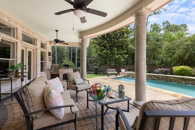 63 N Wooded Brook Cir, The Woodlands, TX 77382 - fenced backyard with a ceiling fan, french doors, exterior kitchen, and a patio