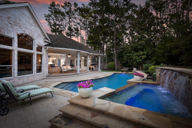 63 N Wooded Brook Cir, The Woodlands, TX 77382 - view of swimming pool with a patio area and a pool with connected hot tub