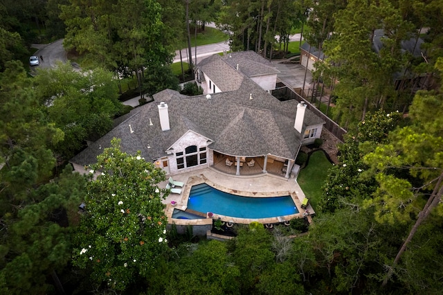 63 N Wooded Brook Cir, The Woodlands, TX 77382 - view from above of property with a pool