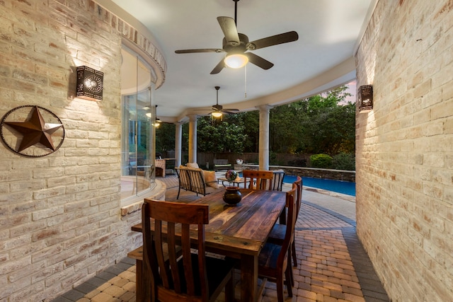 63 N Wooded Brook Cir, The Woodlands, TX 77382 - view of patio with a ceiling fan, outdoor dining area, and an outdoor pool