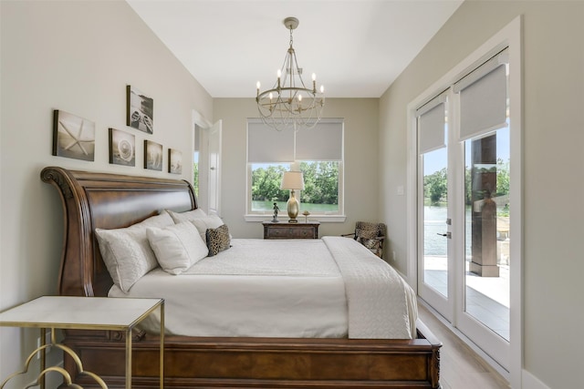 18 N Smith Loop N, Cleveland, TX 77327 - bedroom with a chandelier and access to exterior