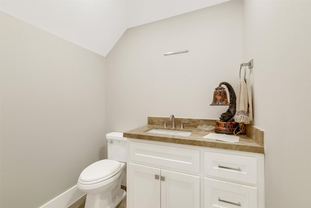 18 N Smith Loop N, Cleveland, TX 77327 - bathroom with toilet, vanity, and vaulted ceiling