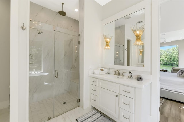 18 N Smith Loop N, Cleveland, TX 77327 - ensuite bathroom featuring a marble finish shower, vanity, and recessed lighting