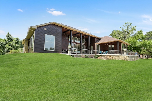 18 N Smith Loop N, Cleveland, TX 77327 - rear view of property featuring ceiling fan and a lawn