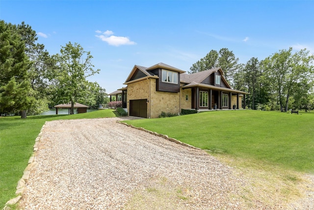 18 N Smith Loop N, Cleveland, TX 77327 - view of property exterior featuring a yard, dirt driveway, a porch, and stone siding