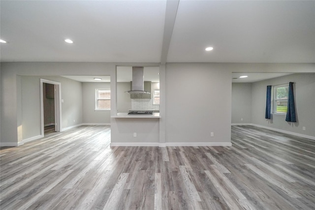 5915 Valkeith Dr, Houston, TX 77096 - unfurnished living room featuring recessed lighting, wood finished floors, and baseboards