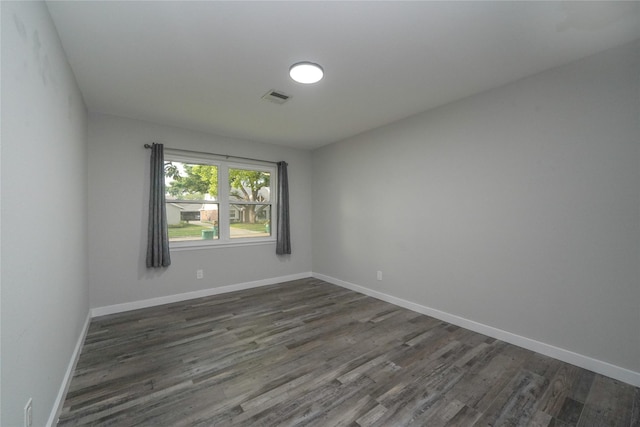 5915 Valkeith Dr, Houston, TX 77096 - spare room featuring dark wood-style floors and baseboards