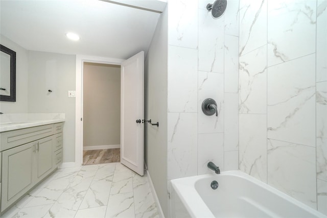 5915 Valkeith Dr, Houston, TX 77096 - bathroom featuring vanity, marble look tiles, shower / tub combination, baseboards, and recessed lighting