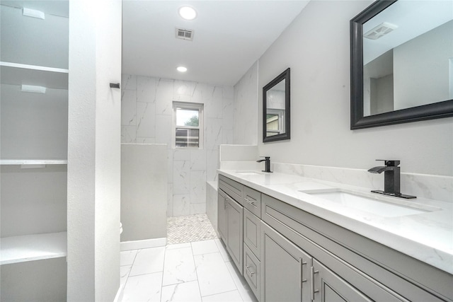 5915 Valkeith Dr, Houston, TX 77096 - bathroom with marble finish floors, double vanity, a marble finish shower, and recessed lighting