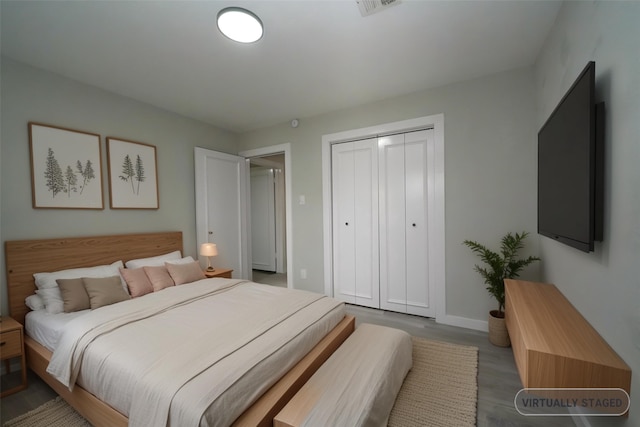 5915 Valkeith Dr, Houston, TX 77096 - bedroom with a closet, wood finished floors, and baseboards