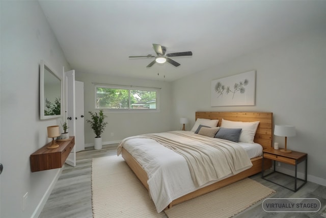 5915 Valkeith Dr, Houston, TX 77096 - bedroom with baseboards, light wood-style floors, and ceiling fan