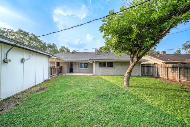 5915 Valkeith Dr, Houston, TX 77096 - rear view of property with brick siding and a patio area