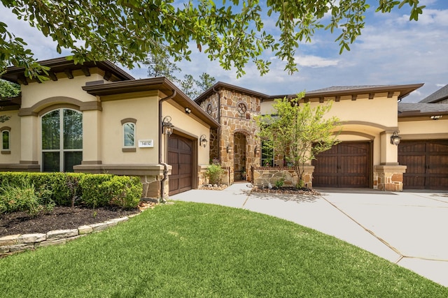 34132 Willow Bluff Ln, Pinehurst, TX 77362 - mediterranean / spanish home with stucco siding, a garage, stone siding, and driveway
