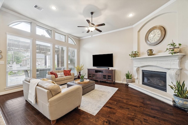 34132 Willow Bluff Ln, Pinehurst, TX 77362 - living room with ceiling fan, wood finished floors, ornamental molding, baseboards, and recessed lighting