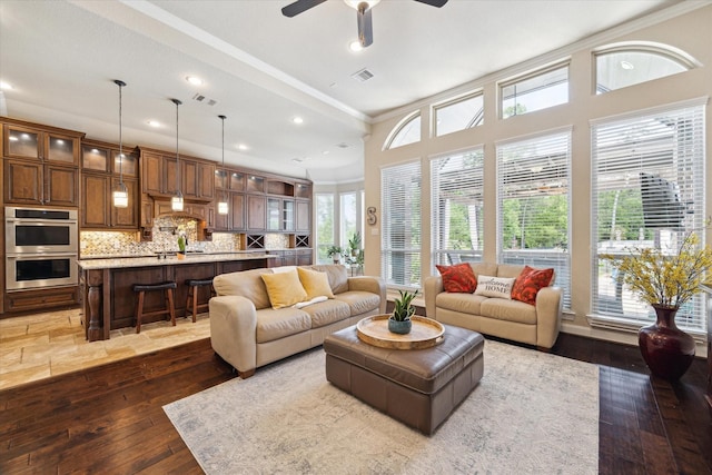 34132 Willow Bluff Ln, Pinehurst, TX 77362 - living room with crown molding, hardwood / wood-style floors, ceiling fan, and recessed lighting