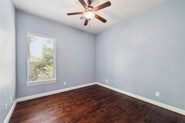 34132 Willow Bluff Ln, Pinehurst, TX 77362 - spare room featuring dark wood-style floors, baseboards, and a ceiling fan