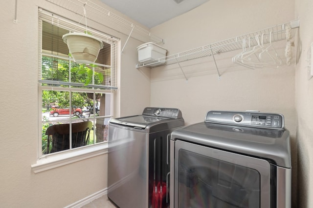9226 Birch Springs Dr, Houston, TX 77095 - laundry area featuring separate washer and dryer and baseboards