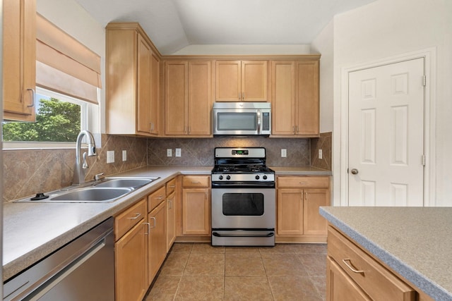 9226 Birch Springs Dr, Houston, TX 77095 - kitchen featuring appliances with stainless steel finishes, a sink, light countertops, decorative backsplash, and light tile patterned floors
