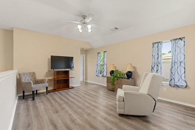 9226 Birch Springs Dr, Houston, TX 77095 - living area featuring light wood finished floors, baseboards, ceiling fan, and lofted ceiling