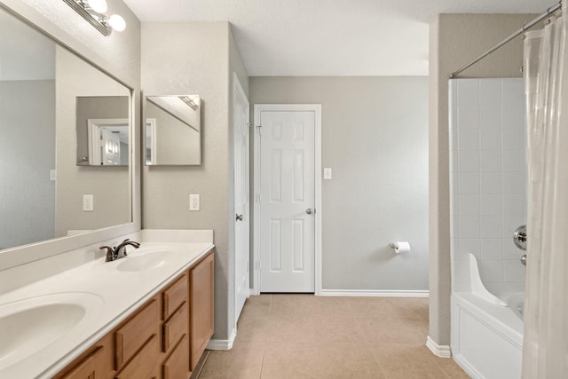 9226 Birch Springs Dr, Houston, TX 77095 - full bath featuring double vanity, baseboards, tile patterned floors, and shower / bath combo with shower curtain