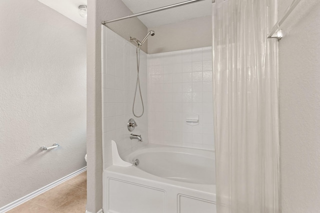 9226 Birch Springs Dr, Houston, TX 77095 - full bath featuring baseboards, shower / bath combo with shower curtain, a textured wall, tile patterned flooring, and toilet