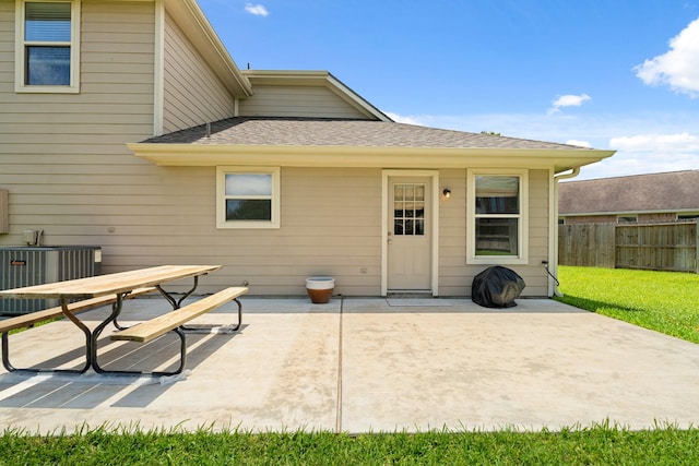 9226 Birch Springs Dr, Houston, TX 77095 - rear view of property featuring a patio, a shingled roof, cooling unit, and outdoor dining space