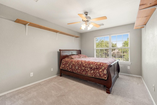 9226 Birch Springs Dr, Houston, TX 77095 - bedroom with light carpet, ceiling fan, and baseboards
