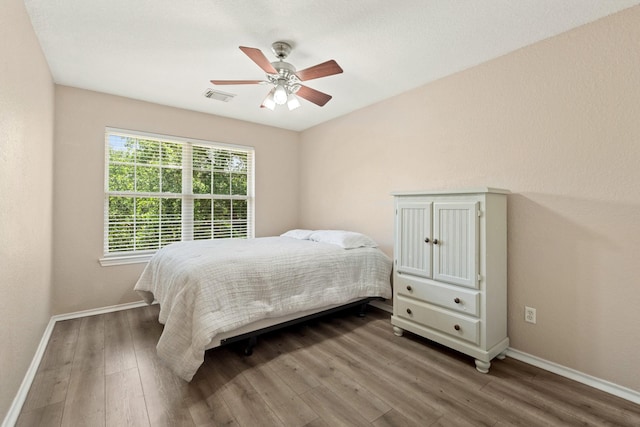 9226 Birch Springs Dr, Houston, TX 77095 - bedroom featuring wood finished floors, baseboards, and ceiling fan
