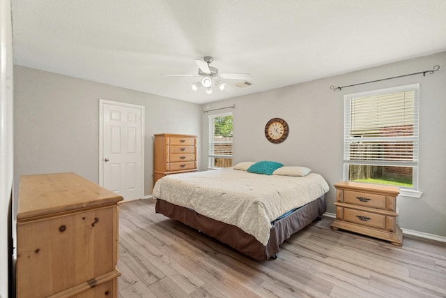 9226 Birch Springs Dr, Houston, TX 77095 - bedroom with light wood-style flooring, baseboards, and ceiling fan