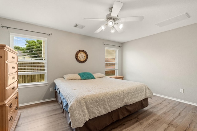 9226 Birch Springs Dr, Houston, TX 77095 - bedroom with light wood finished floors, baseboards, and ceiling fan
