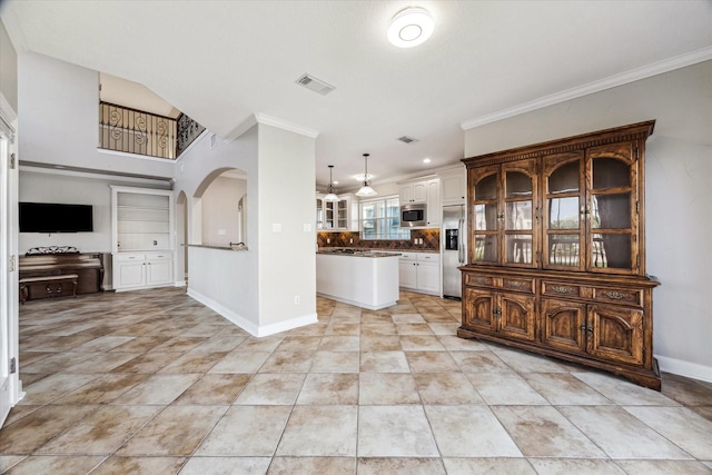 21 Fleming, Hitchcock, TX 77563 - kitchen featuring built in appliances, crown molding, open floor plan, glass insert cabinets, and dark countertops
