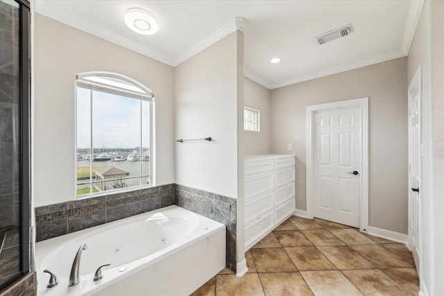 21 Fleming, Hitchcock, TX 77563 - full bath featuring ornamental molding, a tub with jets, healthy amount of natural light, and tile patterned flooring