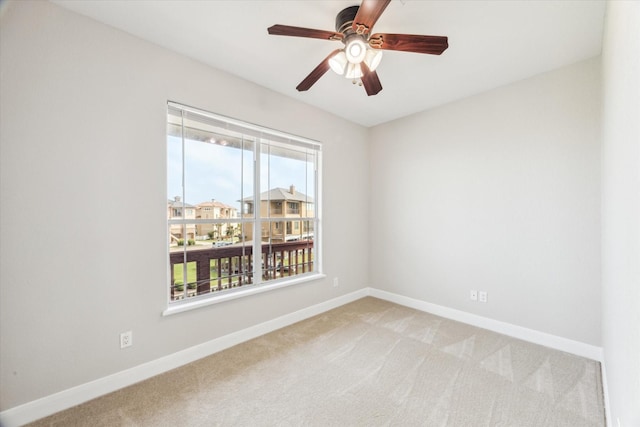 21 Fleming, Hitchcock, TX 77563 - unfurnished room with light carpet, baseboards, and ceiling fan