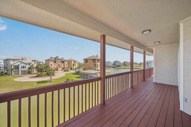 21 Fleming, Hitchcock, TX 77563 - wooden terrace with a residential view, a yard, and a water view