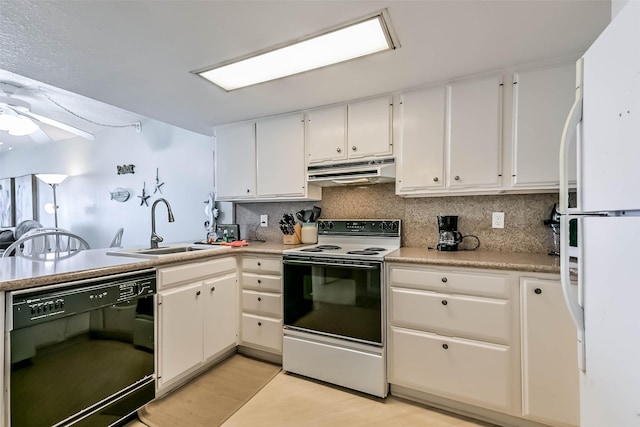 7310 Seawall Blvd Unit 907, Galveston, TX 77551 - kitchen with electric range oven, black dishwasher, freestanding refrigerator, under cabinet range hood, and backsplash