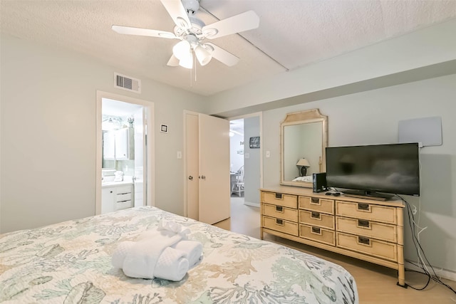 7310 Seawall Blvd Unit 907, Galveston, TX 77551 - bedroom with ceiling fan and a textured ceiling