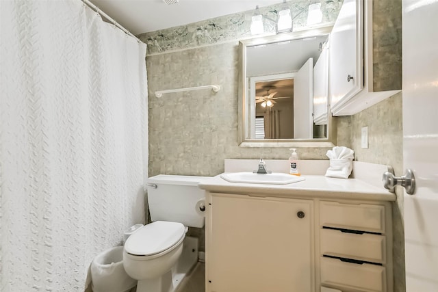 7310 Seawall Blvd Unit 907, Galveston, TX 77551 - full bathroom with vanity, toilet, a ceiling fan, and a shower with shower curtain